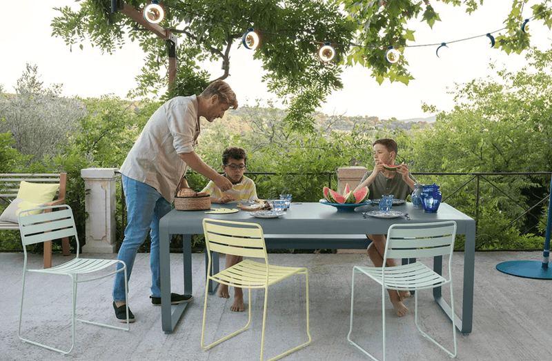 Load image into Gallery viewer, HOOPIK String Lights L1200 cm Outdoor Lighting - Custom Wood DesignsFermob HOOPIK outdoor string lights hanging above a restaurant patio, creating a warm, inviting outdoor lighting atmosphere.Fermob Lamp24575196027671AcapulcoE &amp; F France Germany
