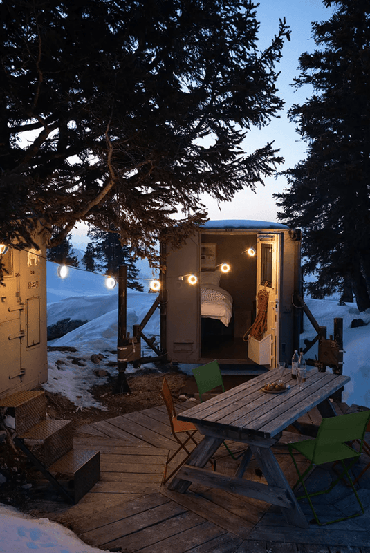 HOOPIK String Lights L1200 cm Outdoor Lighting - Custom Wood DesignsFermob HOOPIK outdoor string lights hanging above an outdoor restaurant setting, providing ambient lighting.Fermob Lamp24575196027671AcapulcoE & F France Germany
