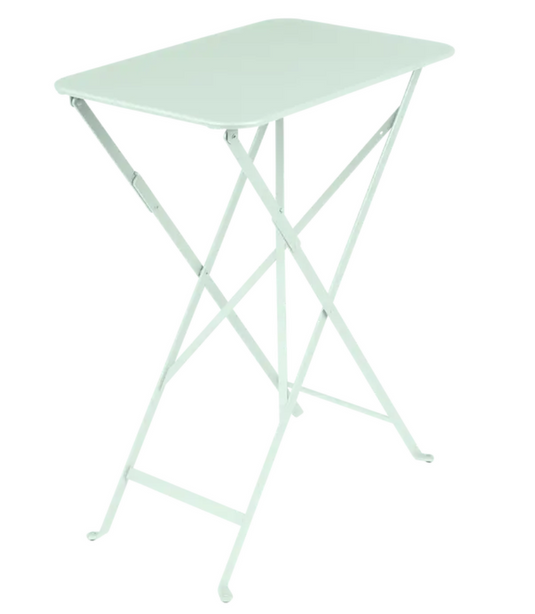 Fermob Bistro folding table in bright green with rectangular metal top, perfect for outdoor cafe or small space use.