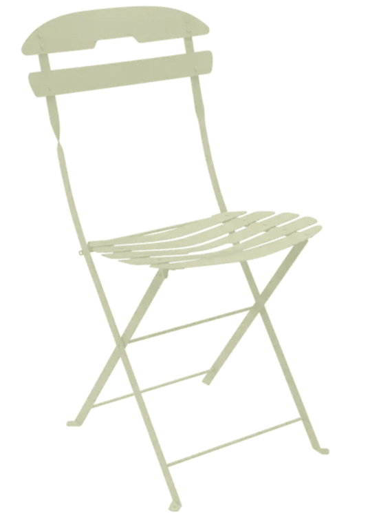 Fermob LA MÔME folding chair in willow green, lightweight and foldable patio furniture, with a sleek modern design.