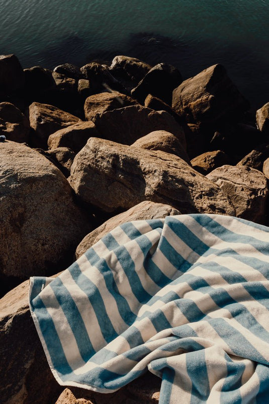 Lagoa GRS beach towel - Custom Wood DesignsVinga Lagoa GRS beach towel spread out outdoors, featuring vibrant patterns and soft, absorbent fabric for beach or outdoor use.OutdoorV4502315Recycled cottonlight blue