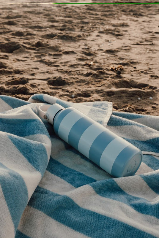 Lagoa GRS beach towel - Custom Wood DesignsVinga Lagoa GRS outdoor beach towel with vibrant blue and green patterns laid flat on a sandy beachOutdoorV4502315Recycled cottonlight blue