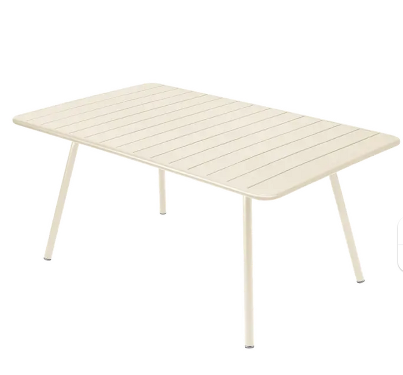 Load image into Gallery viewer, Latte beige Fermob Luxembourg metal outdoor table, 165 x 100 cm, sturdy and stylish for garden or patio use.
