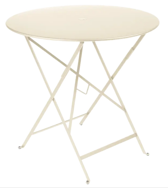 Fermob Bistro round folding table, 77cm diameter, latte beige outdoor cafe table with metal surface for four seats.