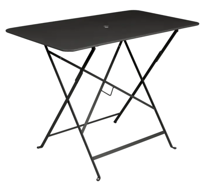 Load image into Gallery viewer, Fermob metal foldable bistro table 97x57 cm with liquorice finish, UV-resistant steel surface for patio or hotel dining settings.
