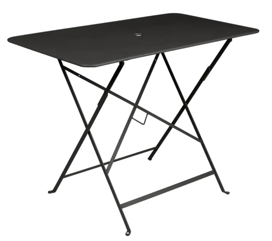 Fermob metal foldable bistro table 97x57 cm with liquorice finish, UV-resistant steel surface for patio or hotel dining settings.