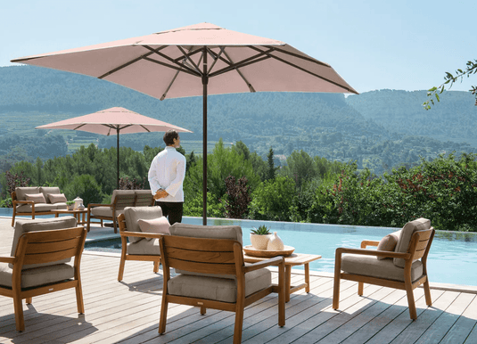 Lodge Low Armchair Teak - Custom Wood DesignsFermob Lodge Low Armchair outdoor teak seating on hotel terrace, showing sleek design and natural wood finish.Armchair Outdoor Teak24575192652279BeigeChevron
