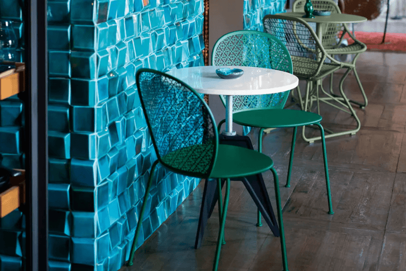 Load image into Gallery viewer, Colorful Fermob Lorette outdoor metal chair with a sleek design, suitable for garden or patio seating.
