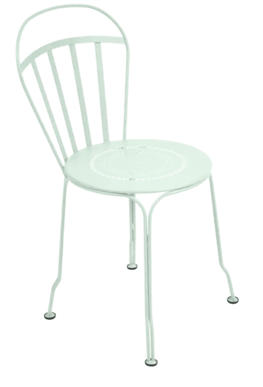 Ice Mint Fermob Louvre outdoor chair with a curved metal frame and slatted seat, designed for stylish outdoor seating.