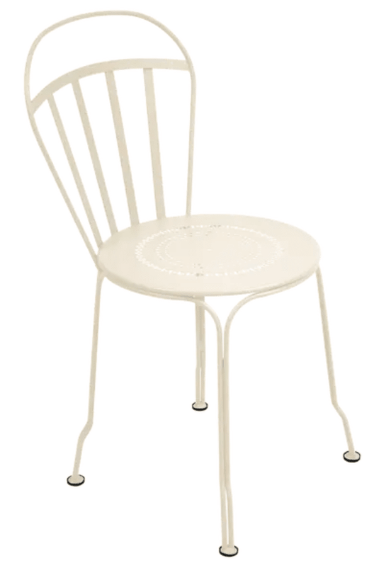 Fermob Louvre outdoor chair with latte-colored metal frame and slatted seat and back for stylish outdoor seating.