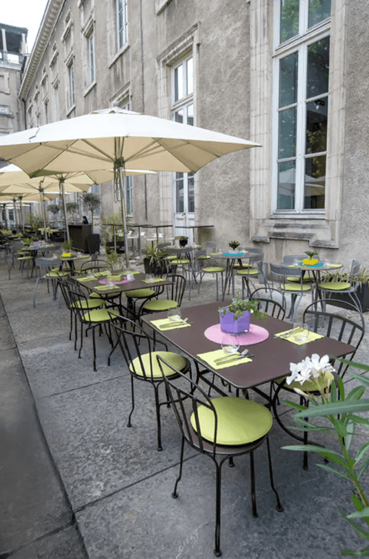 Fermob Louvre outdoor chair with a sleek, modern design in vibrant color, ideal for garden or patio seating.