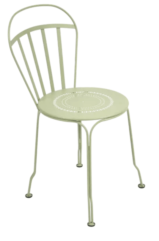 Willow green Fermob Louvre outdoor chair with a sleek metal frame and curved armrests, perfect for garden or patio seating.