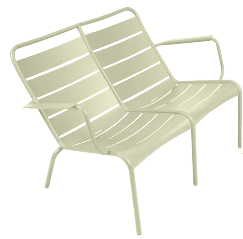 Load image into Gallery viewer, Willow green Fermob Luxembourg Duo Low Armchair and Fermb Kids Corner Contract Bench in a modern outdoor setting
