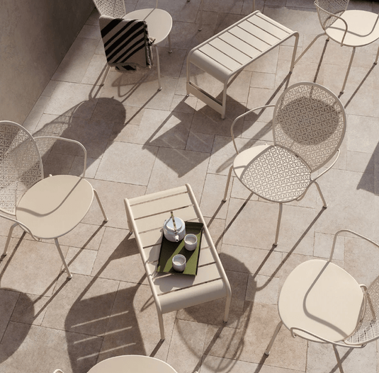 Fermob Luxembourg large low table and bench measuring 86x44, made of durable outdoor furniture with a sleek wooden design.