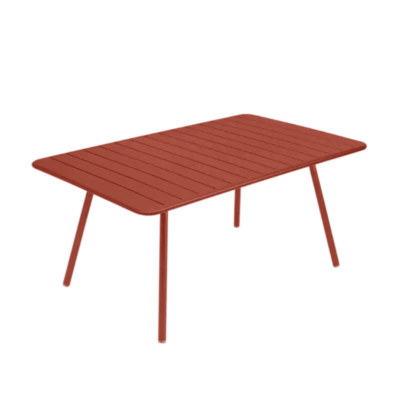 Load image into Gallery viewer, Luxembourg Table 165 x 100 cm - Custom Wood DesignsRed ochre Fermob Luxembourg outdoor metal table, 165 x 100 cm, shown in a natural outdoor setting with a smooth tabletop and sturdy legs.Table Metal24575207108087AluminumRed Ochre
