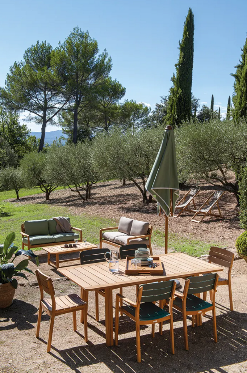 Load image into Gallery viewer, Fermob Lodge Low Armchair in teak wood, outdoor luxury hotel seating with sleek design and natural teak finish.
