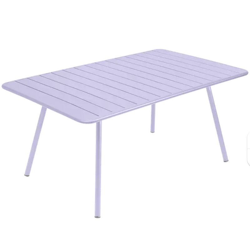 Load image into Gallery viewer, Marshmallow blue Fermob Luxembourg outdoor metal table, 165 x 100 cm, showing a sleek, modern design on a patio setting
