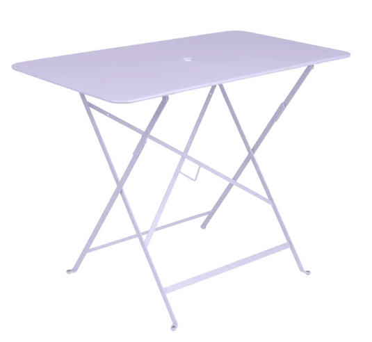 Bright purple Fermob metal foldable bistro table with a 97x57 cm surface, UV-resistant powder-coated finish for outdoor use.