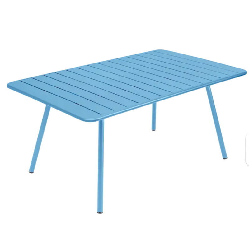 Load image into Gallery viewer, Maya blue Fermob Luxembourg outdoor metal table, 165 x 100 cm, with a sleek, modern design suitable for outdoor dining or patio.
