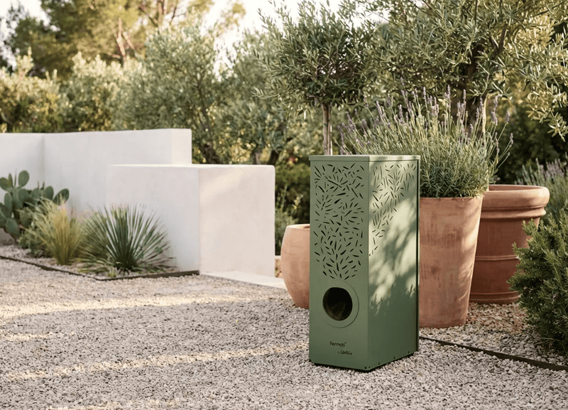 Load image into Gallery viewer, Fermob MOJO Anti-Mosquito Station for mosquito control, featuring sleek design and outdoor use, in a backyard setting.
