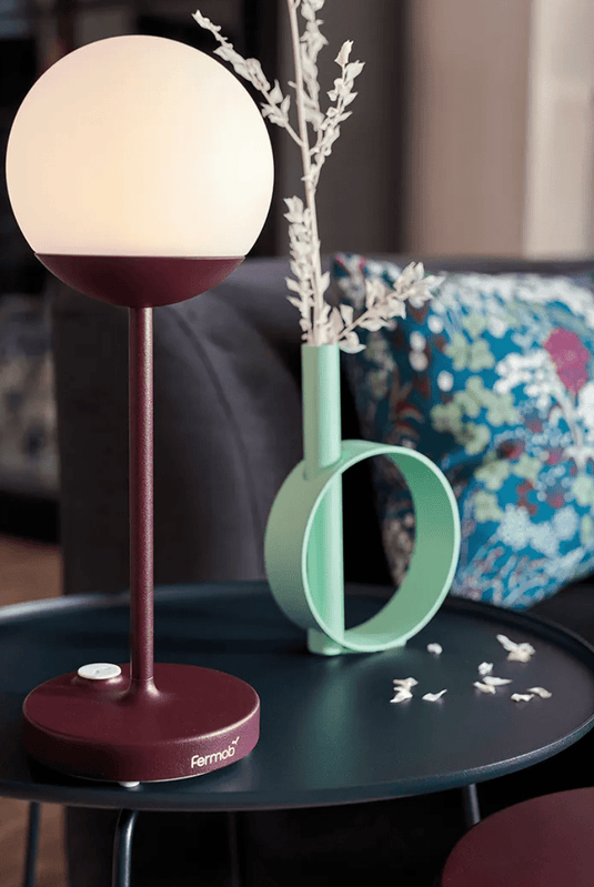 Fermob MOOON! wireless table lamp with moon design, outdoor use, emitting a soft glow, H.41 model for stylish illumination.