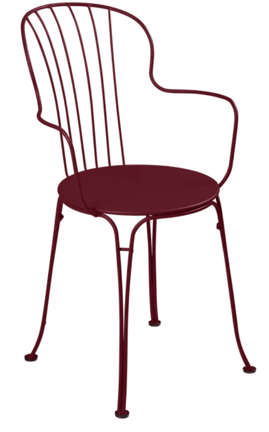 Cherry red Fermob OPÉRA+ outdoor metal armchair with sleek design and curved armrests, perfect for garden or patio seating.