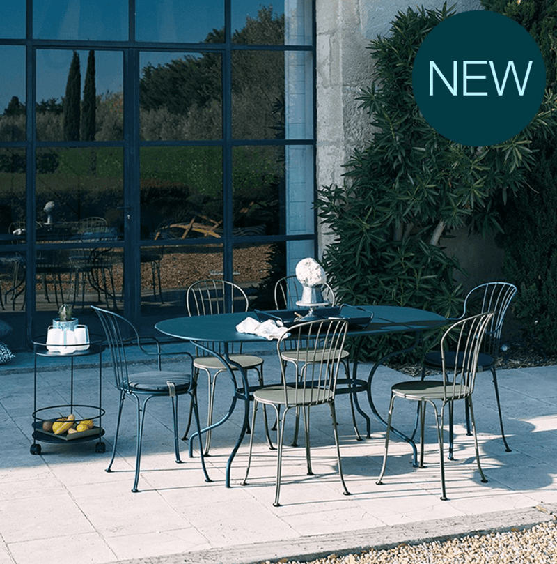 Load image into Gallery viewer, Fermob OPÉRA+ outdoor metal chair with a sleek design, featuring a curved backrest and armrests, ideal for patio seating.
