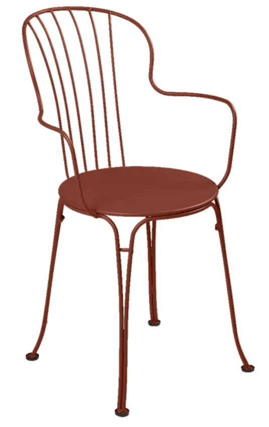 Red Ochre Fermob OPÉRA+ outdoor metal armchair with sleek design and curved armrests, perfect for patio or garden seating.