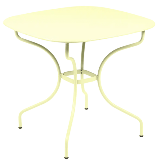 Fermob OPÉRA+ Carronde outdoor metal table with frosted lemon finish, 82x82 cm, suitable for garden or patio use.
