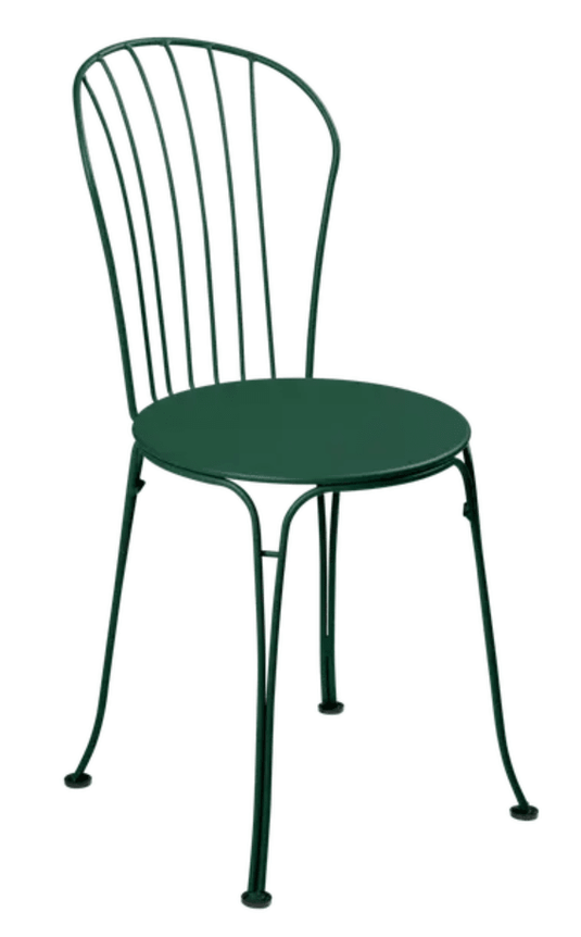 Cedar green Fermob OPÉRA+ metal outdoor chair with curved backrest and armrests, suitable for patio or restaurant outdoor seating.