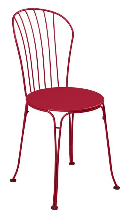 Fermob OPÉRA+ metal outdoor chair in bright red, featuring a stylish design for patio or restaurant seating.
