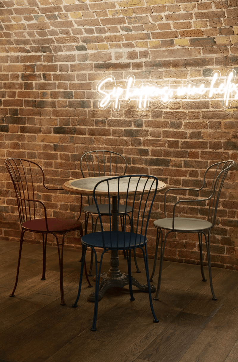 Load image into Gallery viewer, Fermob OPÉRA+ metal outdoor chair with curved backrest and armrests, suitable for restaurant and patio outdoor seating.
