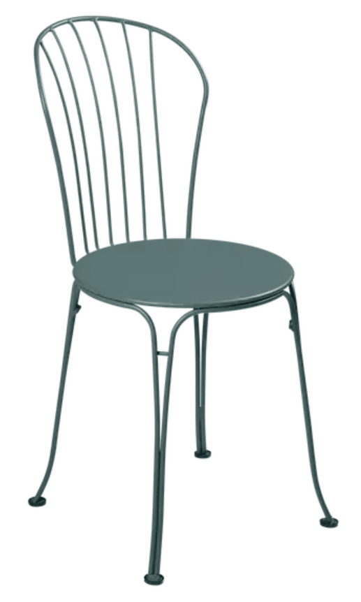 Storm grey Fermob OPÉRA+ metal outdoor chair with sleek design, suitable for restaurant or patio seating, featuring sturdy metal construction.
