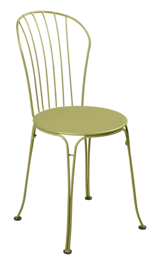 Willow green Fermob OPÉRA+ outdoor metal chair with curved backrest and slender legs, suitable for outdoor restaurant seating.