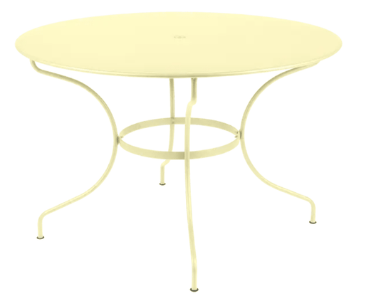 Fermob OPÉRA+ outdoor metal table with a 117 cm diameter in frosted lemon finish, six-seater for patio or garden dining.