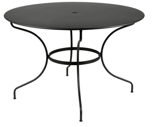 Fermob OPÉRA+ outdoor metal table with 117 cm diameter in Liquorice color, six-seater table for patio or garden.
