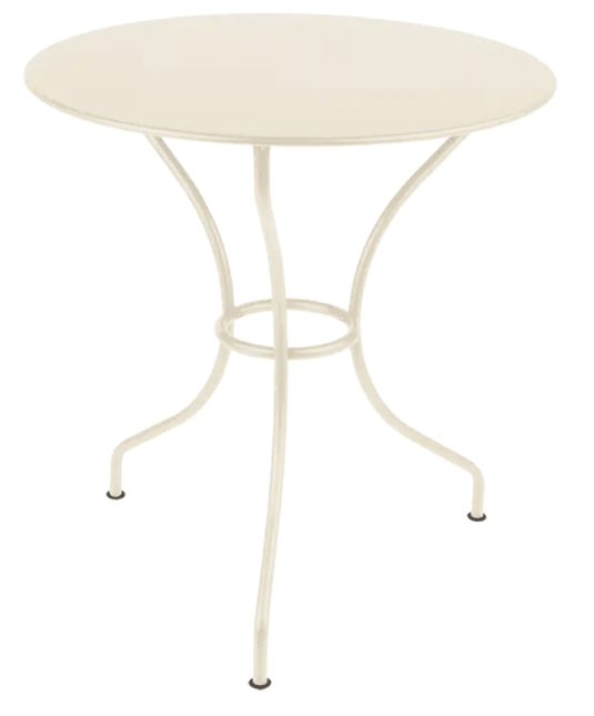 Fermob OPÉRA+ outdoor metal table with a 67 cm diameter in latte beige, suitable for patio or restaurant outdoor settings.