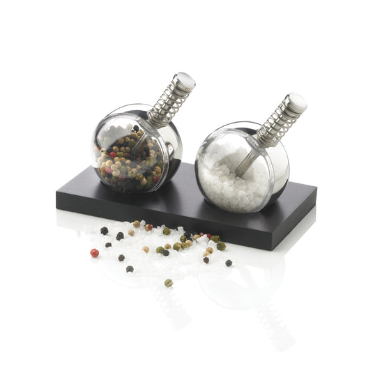XD Design Planet pepper and salt set for home and kitchen, featuring stylish, round containers with black and white caps.