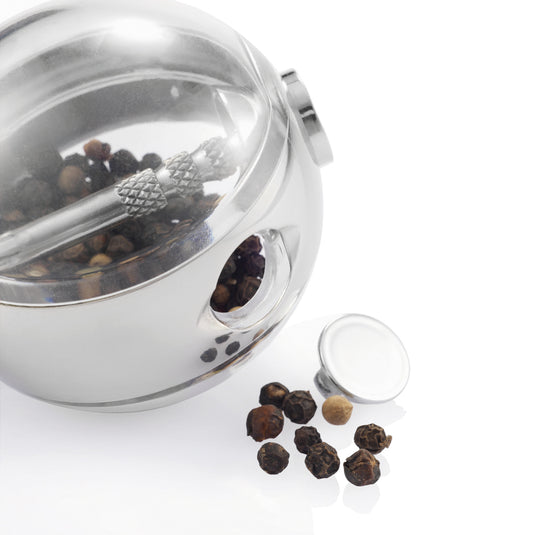 XD Design Planet pepper and salt set with round ceramic shakers and matching stand for stylish kitchen seasoning.