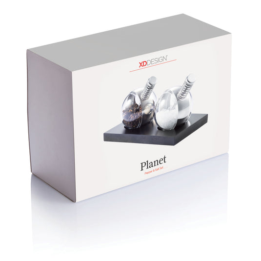 XD Design Planet pepper and salt set with round ceramic shakers featuring colorful planet designs for stylish kitchen storage