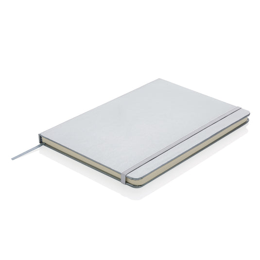 Close-up of XD Collection Classic hardcover A5 notebook showing textured black cover and gold-embossed branding.
