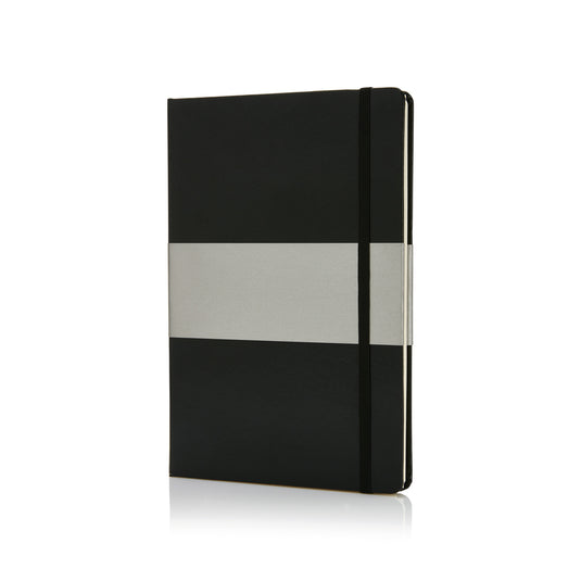 Deluxe hardcover A5 notebook from XD Collection with a sleek black cover, open to show lined pages, ideal for writing and note-taking.