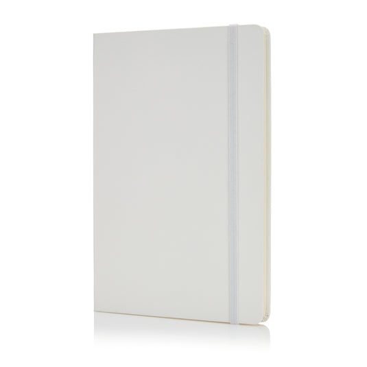Deluxe hardcover A5 notebook from XD Collection with a sleek black cover and gold-embossed logo, open to reveal lined pages.