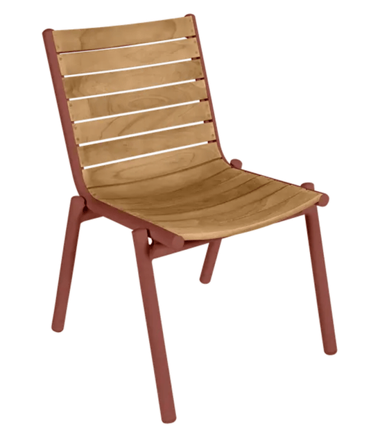 Red ochre Fermob PILOTIS teak outdoor chair with aluminium frame, showcasing its sleek design and durable teak wood slats.