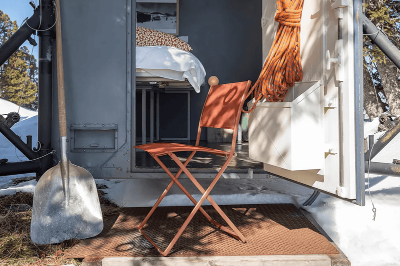 Load image into Gallery viewer, Fermob Plein Air folding chair with a sleek metal frame and fabric seat, perfect for outdoor relaxation and portable seating.
