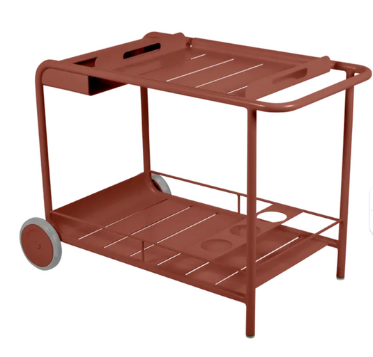 Red Fermob Luxembourg Side Bar trolley with wheels, ideal for restaurant terrace drinks service, featuring a compact, mobile design.