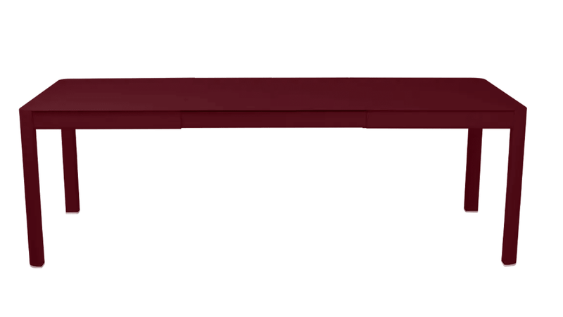 Load image into Gallery viewer, Fermob Ribambelle extendable metal table in black cherry, large 10-seater outdoor dining table with extendable aluminum surface.
