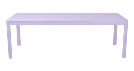 Fermob Ribambelle extendable metal table, large 10-seater outdoor dining table with aluminum surface and extendable design.