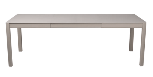 Fermob Ribambelle extendable metal table in nutmeg beige, outdoor 10-seater dining table with extendable aluminium design.
