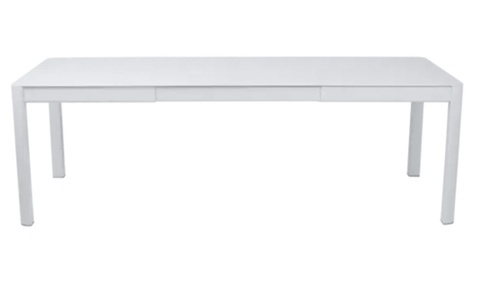 Fermob Ribambelle extendable metal table outdoors, large 10-seater aluminum dining table, perfect for outdoor hospitality use.